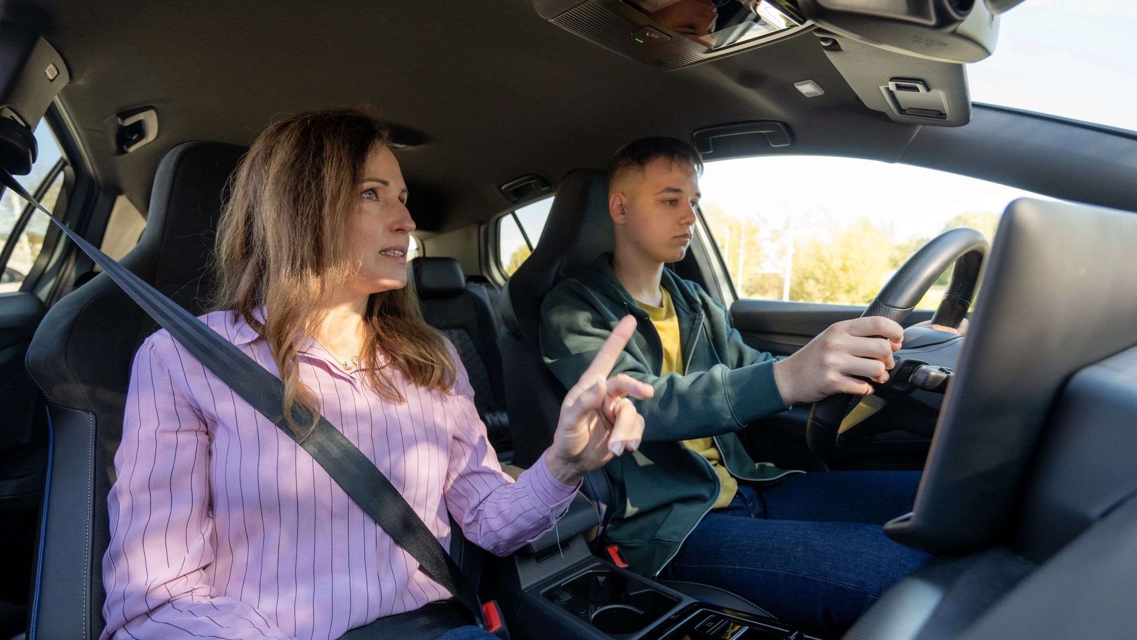 Driving instructor guiding a student during a lesson